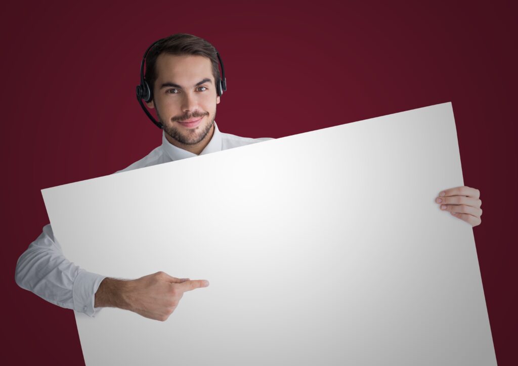 customer-service-man-with-large-blank-card-against-maroon-background