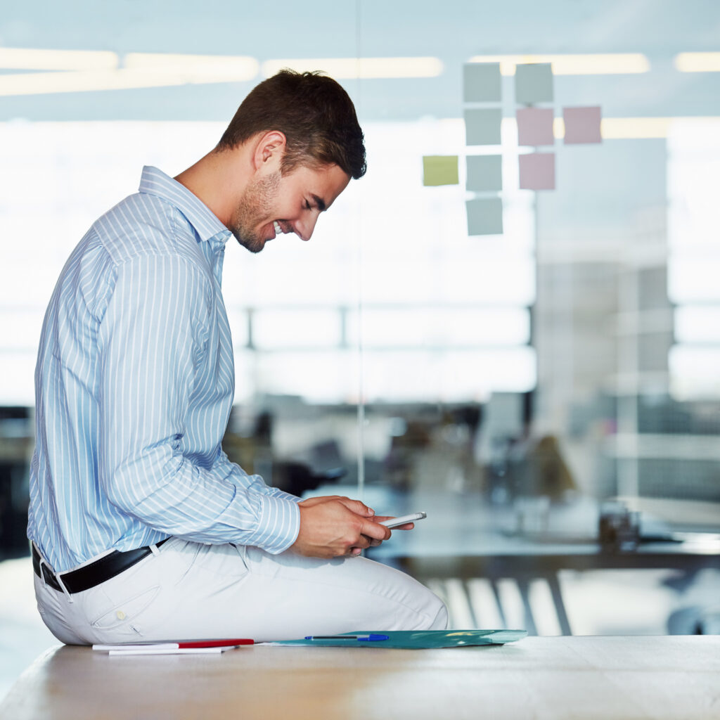 phone-office-business-man-desk-typing-texting-social-media-cellphone-break-happy-male-employee-sitting-table-with-mobile-smartphone-research-networking-internet-browsing